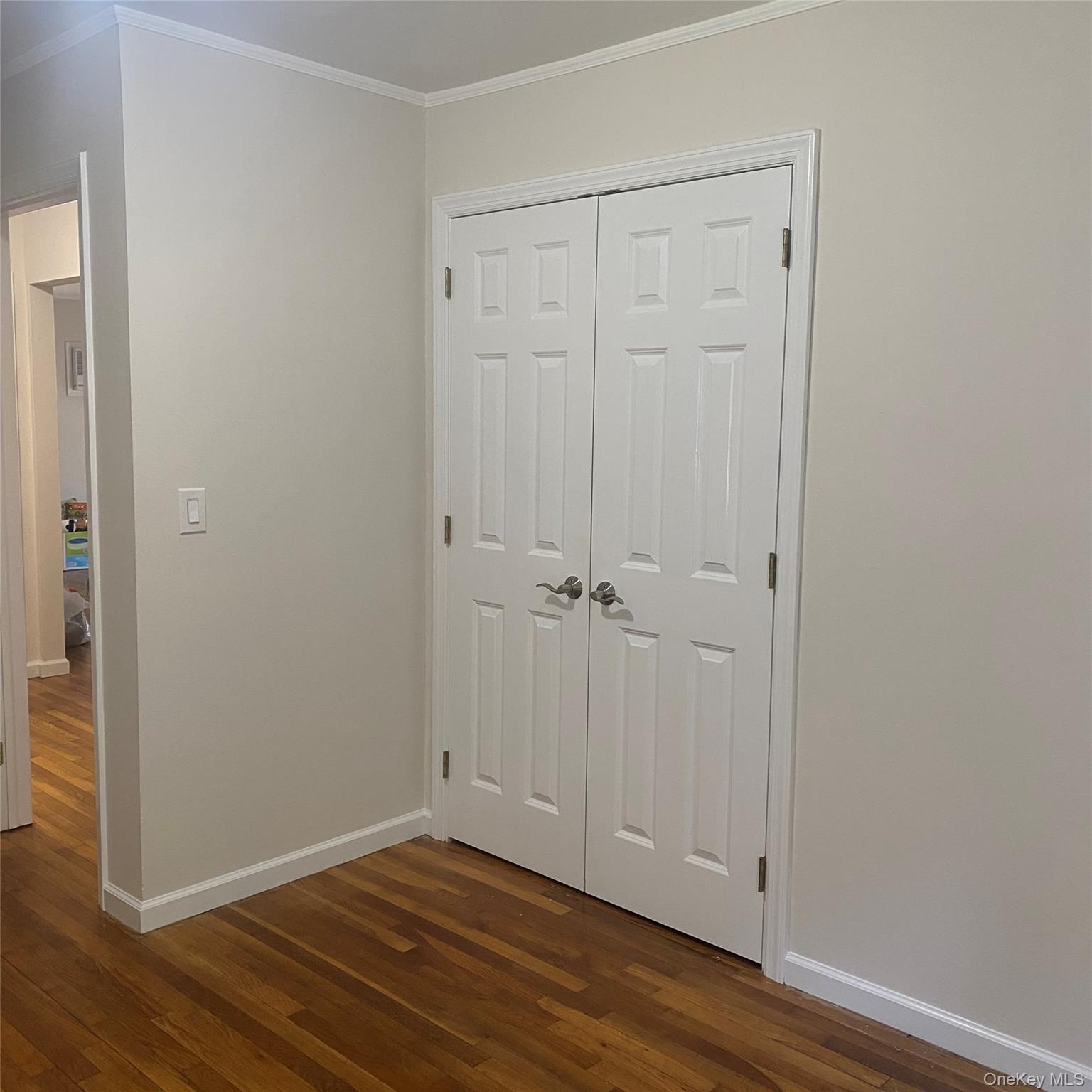 282 Laurel Road, Unit A East Northport, NY 11731 - Photo 15 of 20 a view of room with hardwood floor