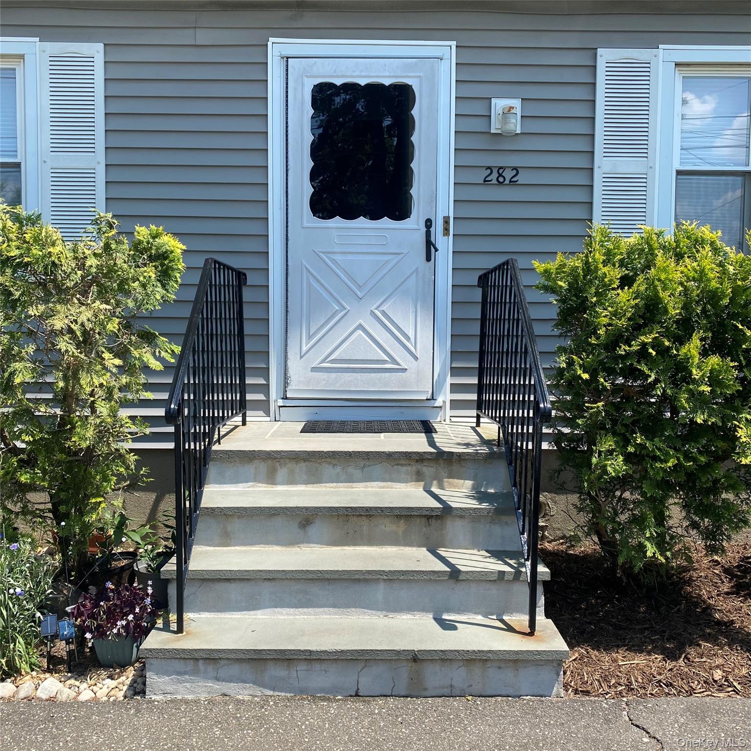 282 Laurel Road, Unit A East Northport, NY 11731 - Photo 2 of 20 a view of entryway with a front door
