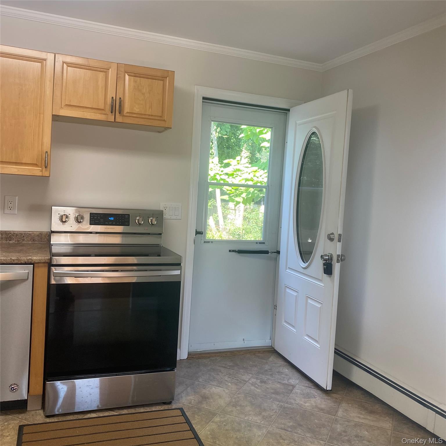 282 Laurel Road, Unit A East Northport, NY 11731 - Photo 4 of 20 a kitchen with granite countertop a stove and a microwave
