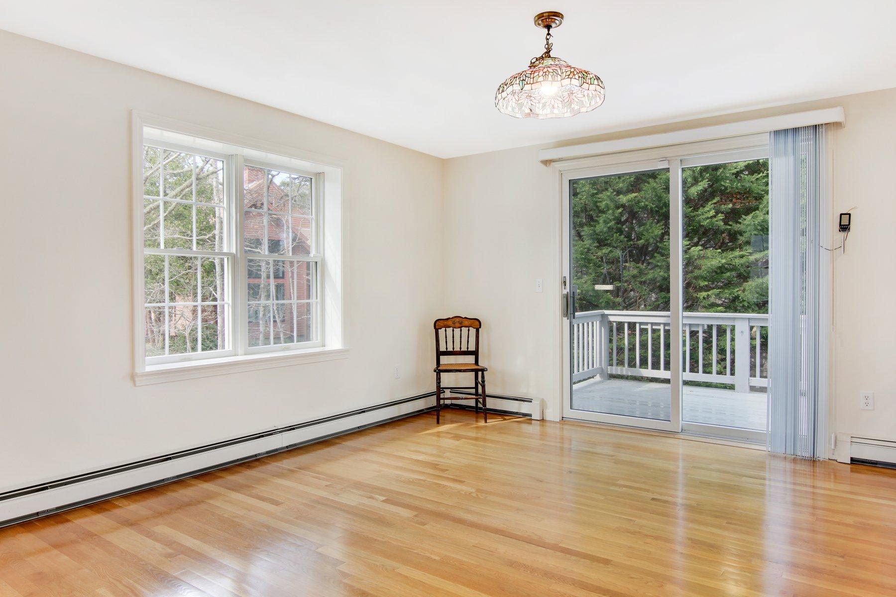 230 Chippingstone Road Chatham, MA 02633 - Photo 17 of 38 a room with a window and wooden floor