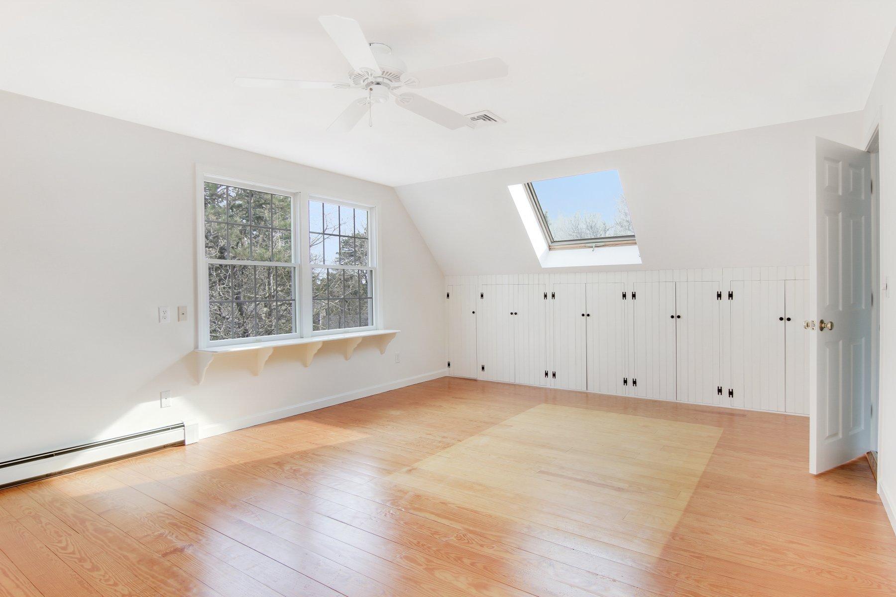 230 Chippingstone Road Chatham, MA 02633 - Photo 35 of 38 an empty room with windows and closet