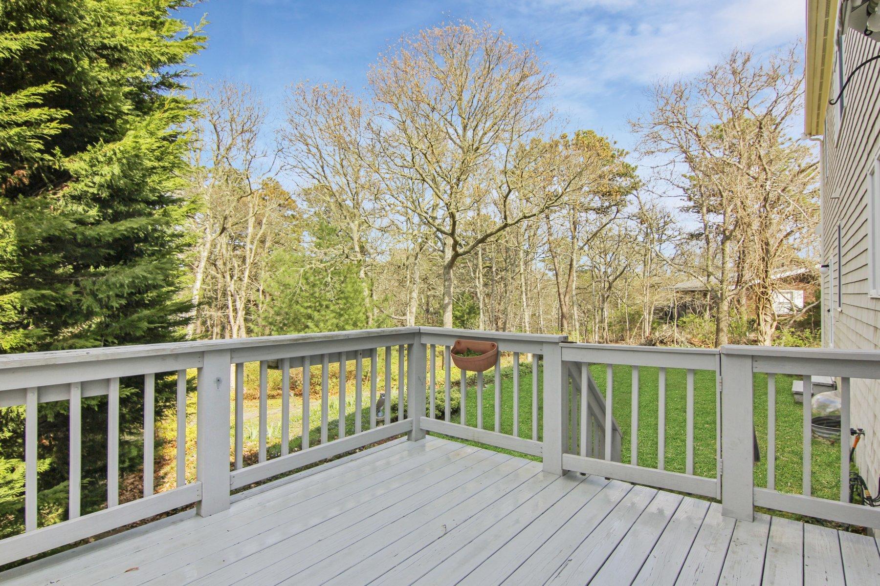 230 Chippingstone Road Chatham, MA 02633 - Photo 5 of 38 a view of balcony with wooden floor and fence
