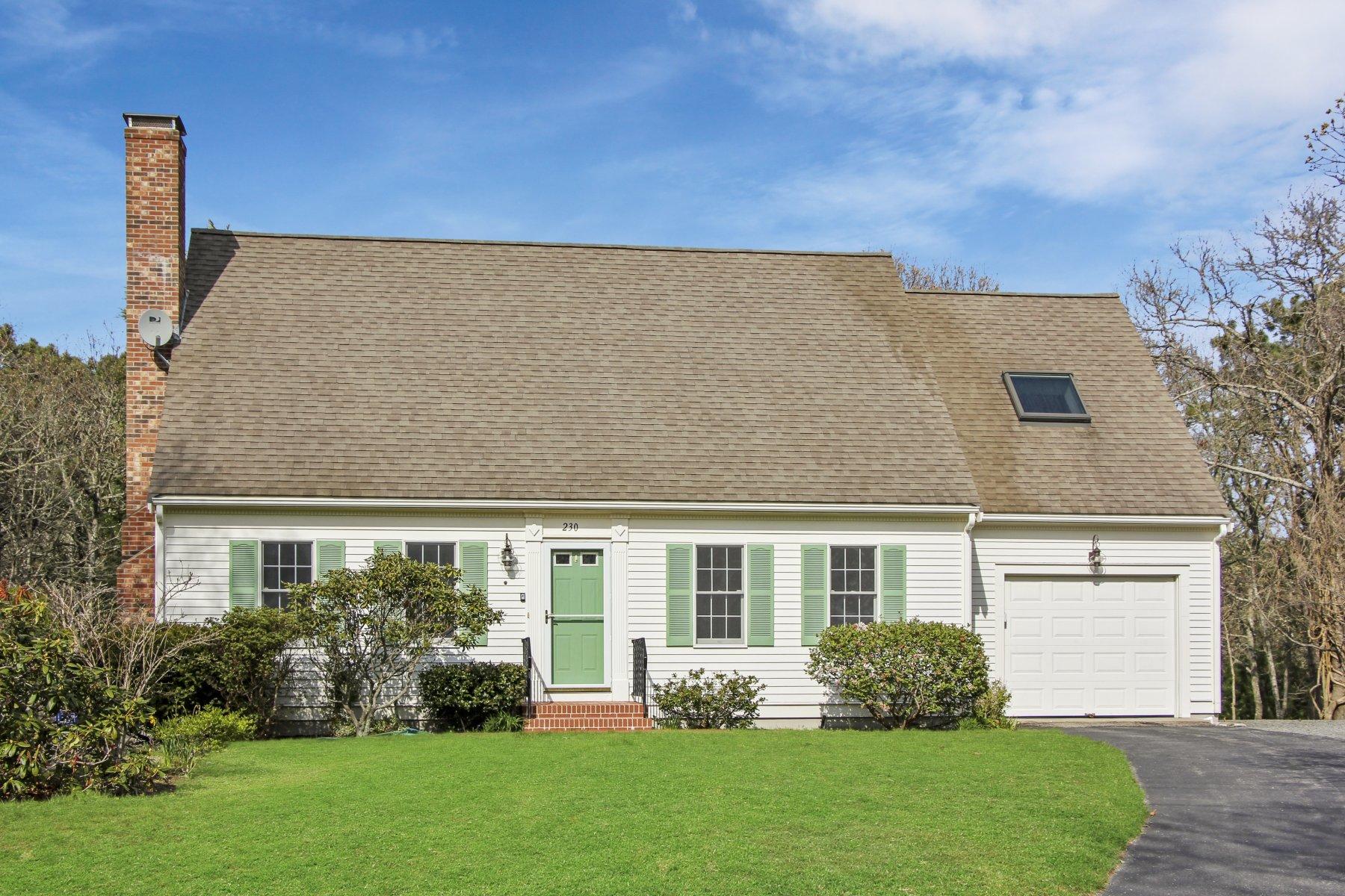 230 Chippingstone Road Chatham, MA 02633 - Photo 10 of 38 a front view of a house with a yard and trees