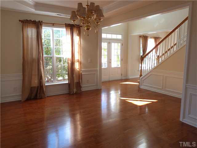 7500 Lagrange Drive Raleigh, NC 27613 - Photo 5 of 20 a view of an empty room with wooden floor and a window