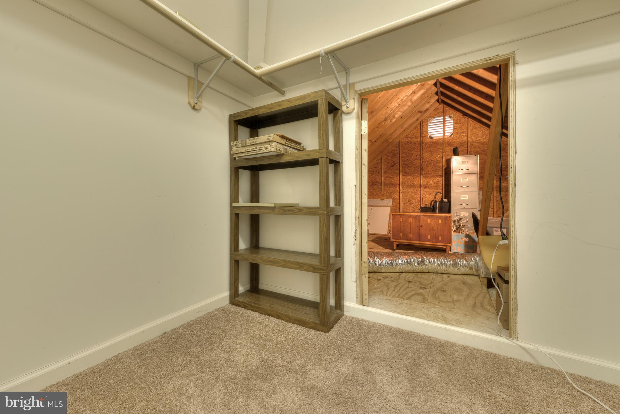 9 Wolfpit Court Rehoboth Beach, DE 19971 - Photo 31 of 31 2nd floor walk in closet leads to attic storage