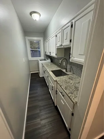 a kitchen with granite countertop lots of counter top space