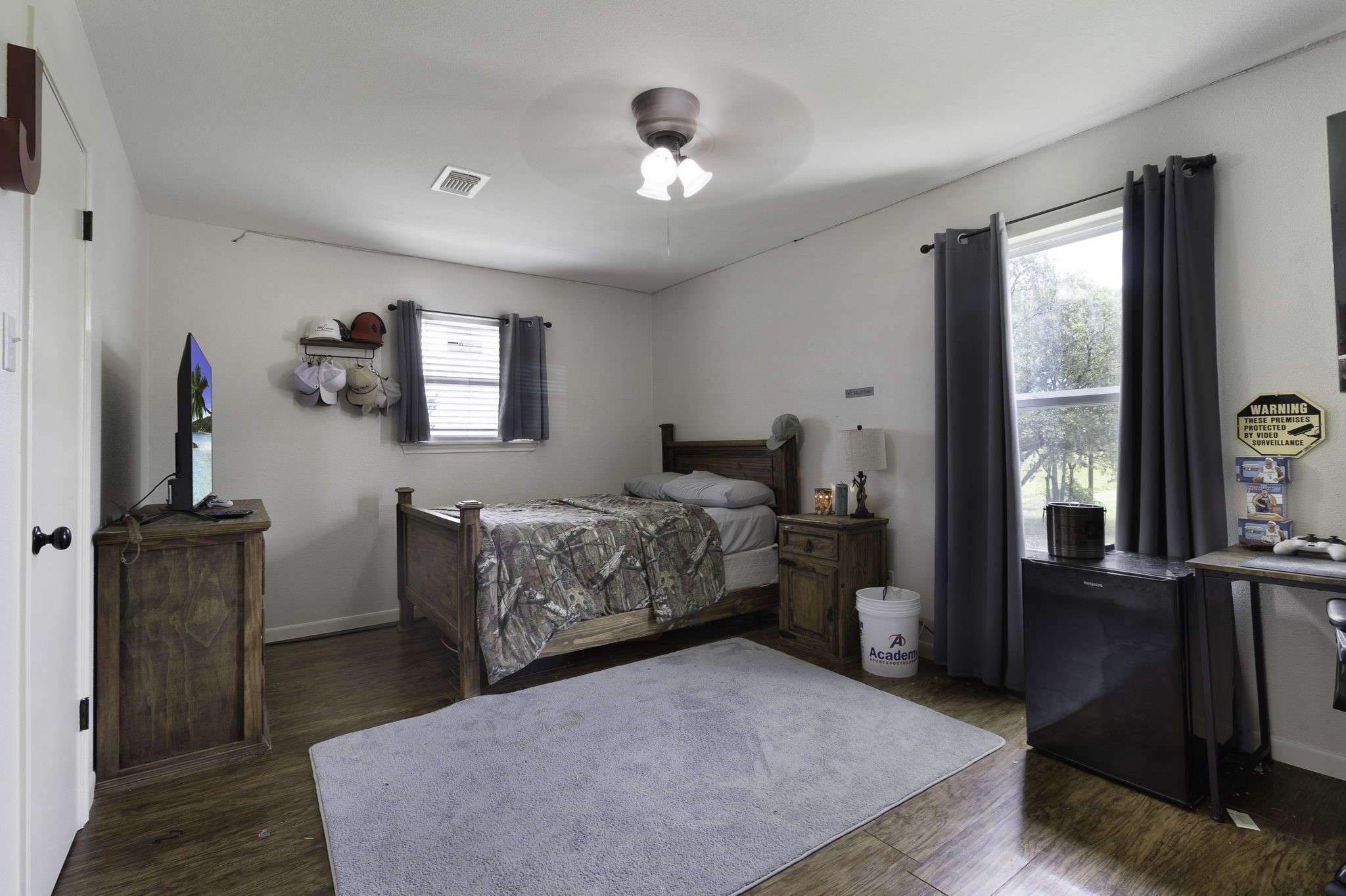 8043 Bell Lane Midway, TX 75852 - Photo 11 of 40 a bedroom with a bed and wooden floor