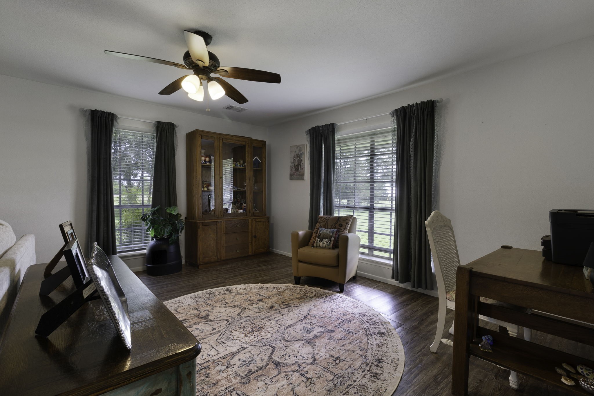 8043 Bell Lane Midway, TX 75852 - Photo 17 of 40 a living room with furniture a chandelier fan and a large window