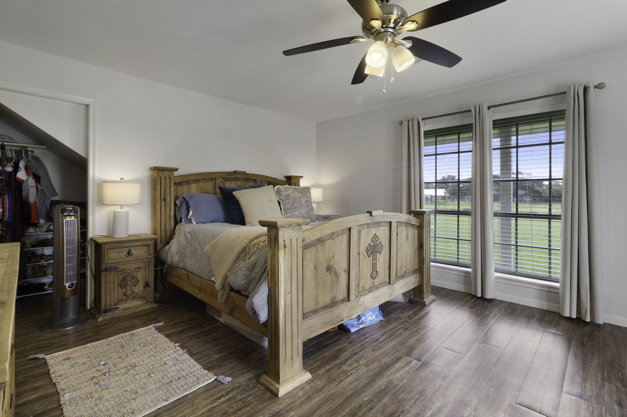 8043 Bell Lane Midway, TX 75852 - Photo 19 of 40 a bed room with a bed and a chandelier