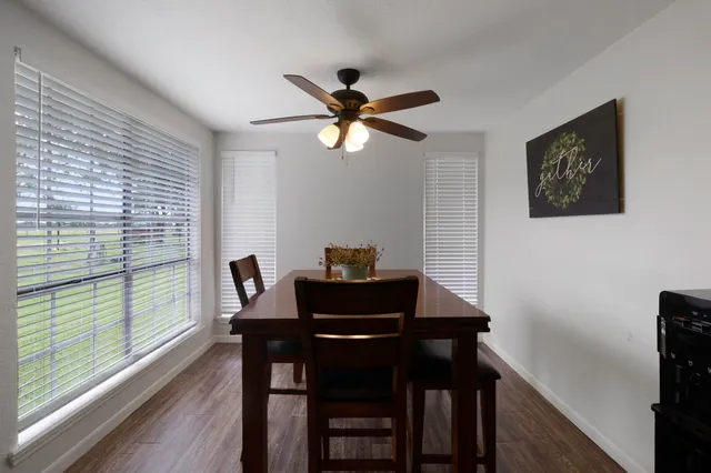 a dining room with furniture and window