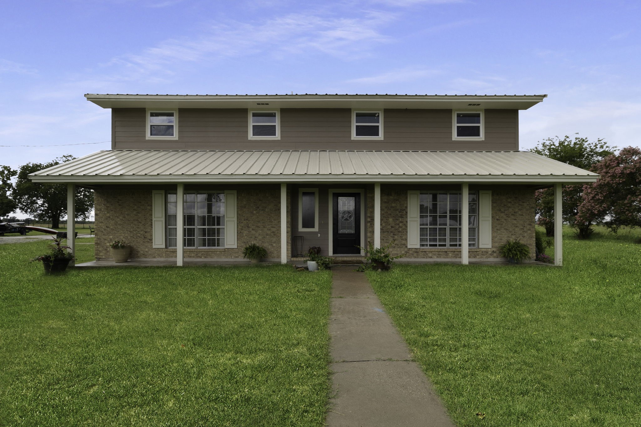 8043 Bell Lane Midway, TX 75852 - Photo 25 of 40 a front view of a house with a garden