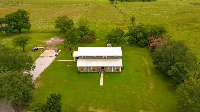 a picture of a lake with a yard