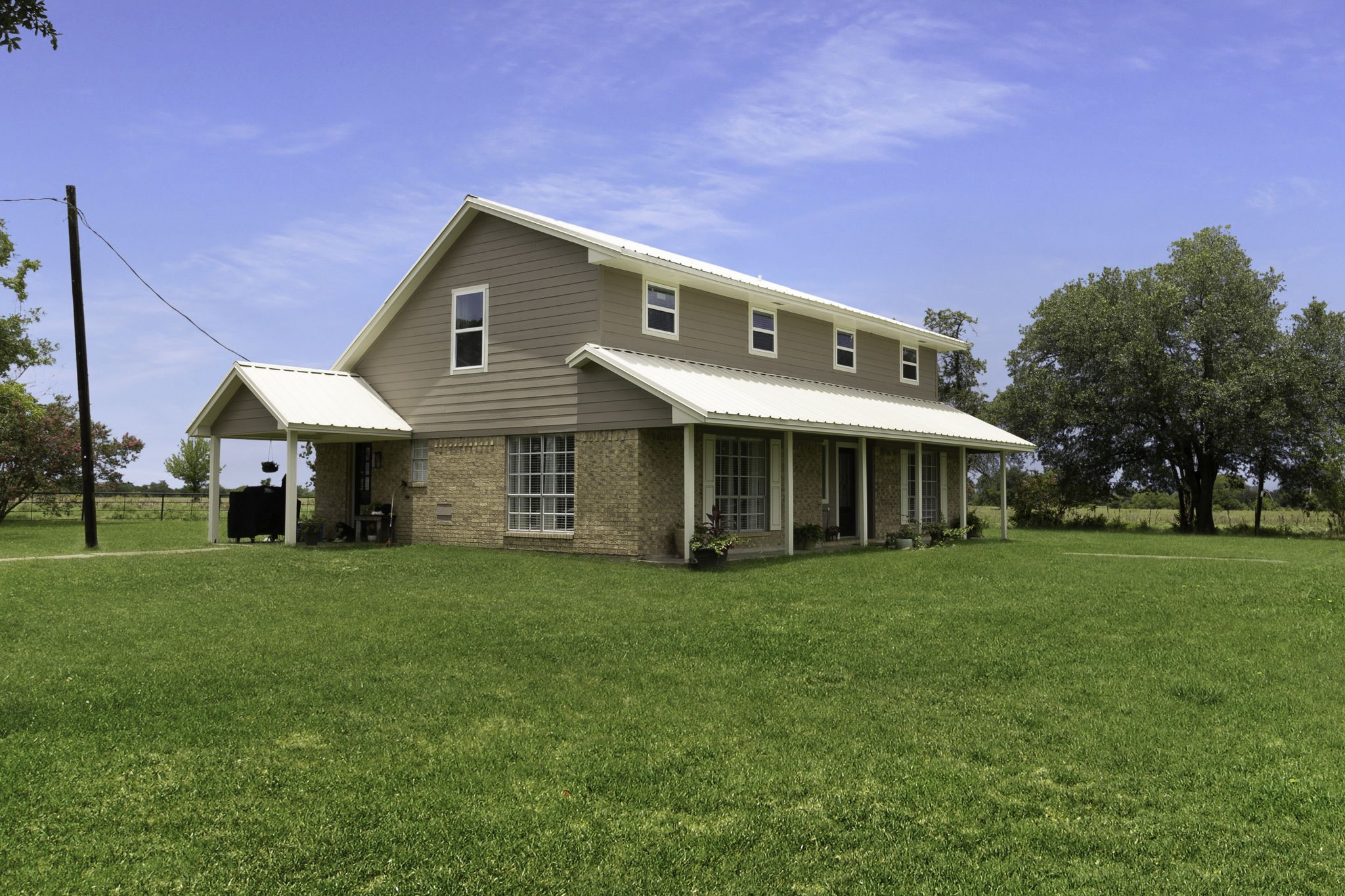 8043 Bell Lane Midway, TX 75852 - Photo 3 of 40 a front view of a house with a garden