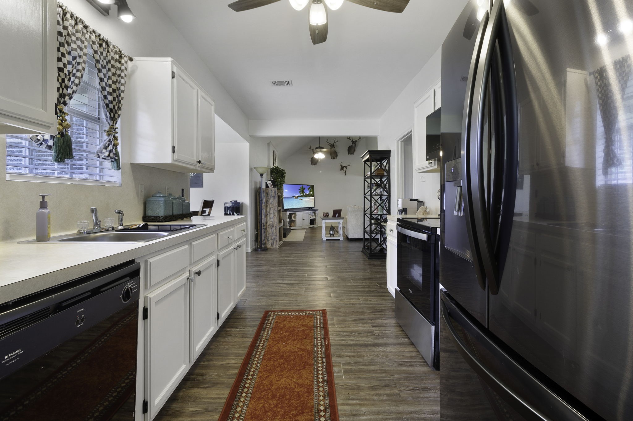 8043 Bell Lane Midway, TX 75852 - Photo 6 of 40 a kitchen with stainless steel appliances a refrigerator and a sink
