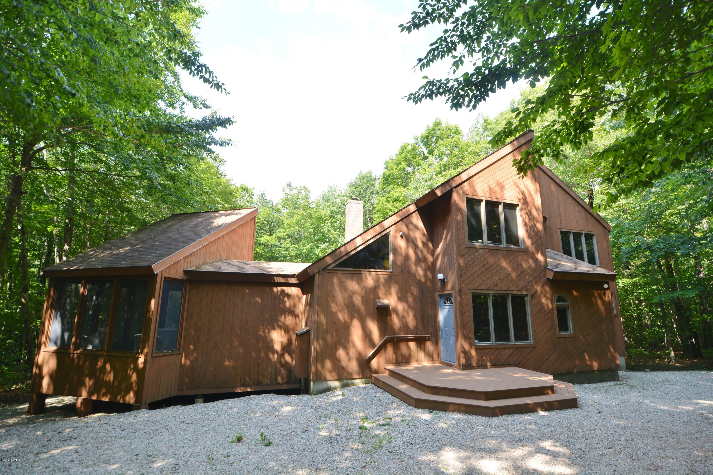 531 Moberg Road Becket, MA 01223 - Photo 1 of 25 a front view of a house with a yard