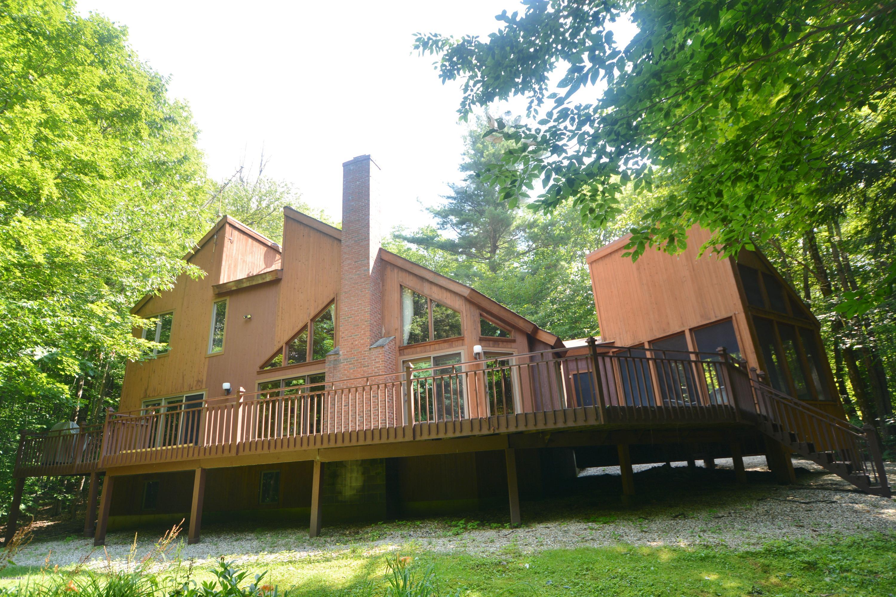 531 Moberg Road Becket, MA 01223 - Photo 2 of 25 a view of front of house with a yard