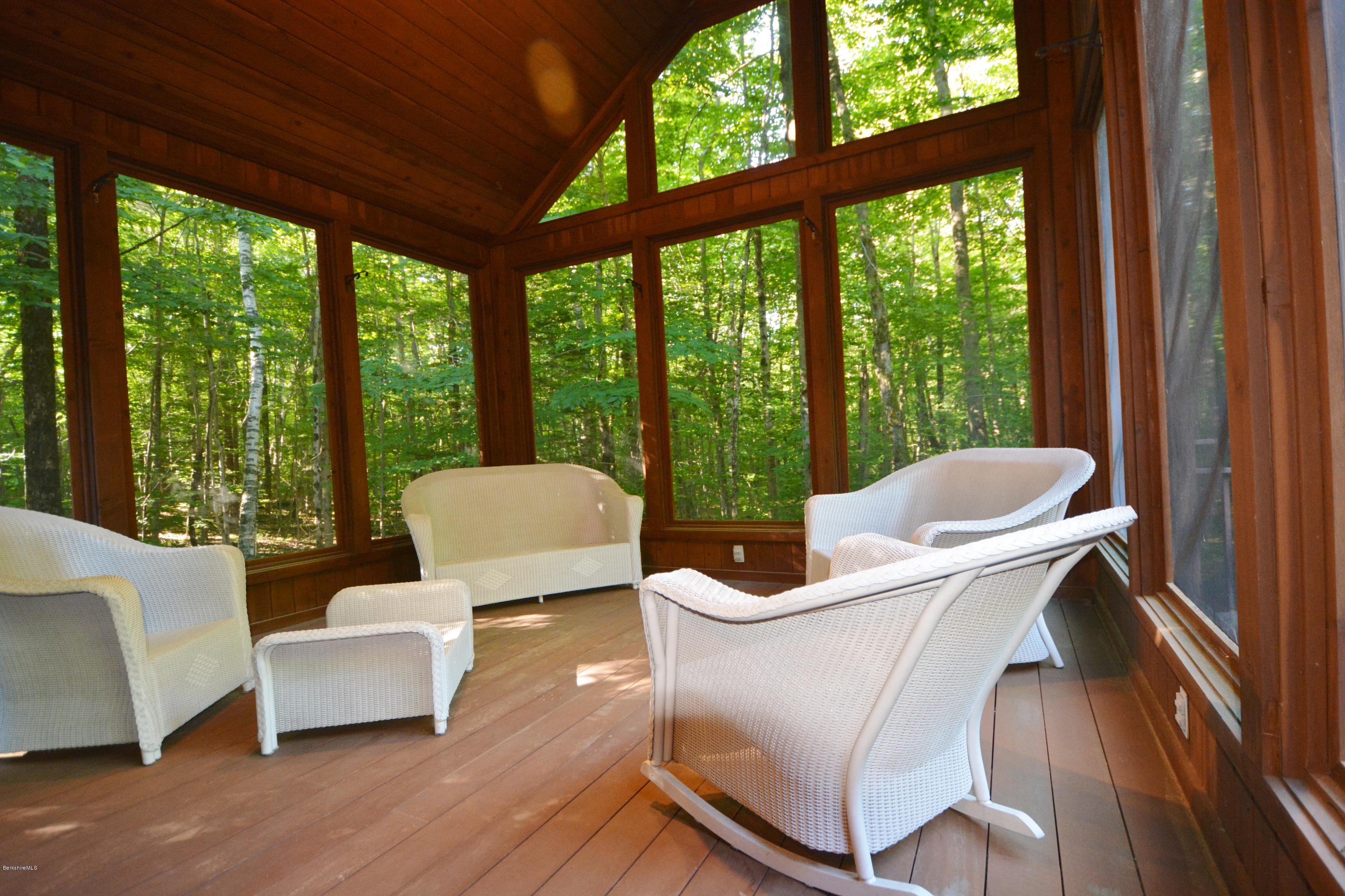 531 Moberg Road Becket, MA 01223 - Photo 13 of 25 a living room with couch and large windows