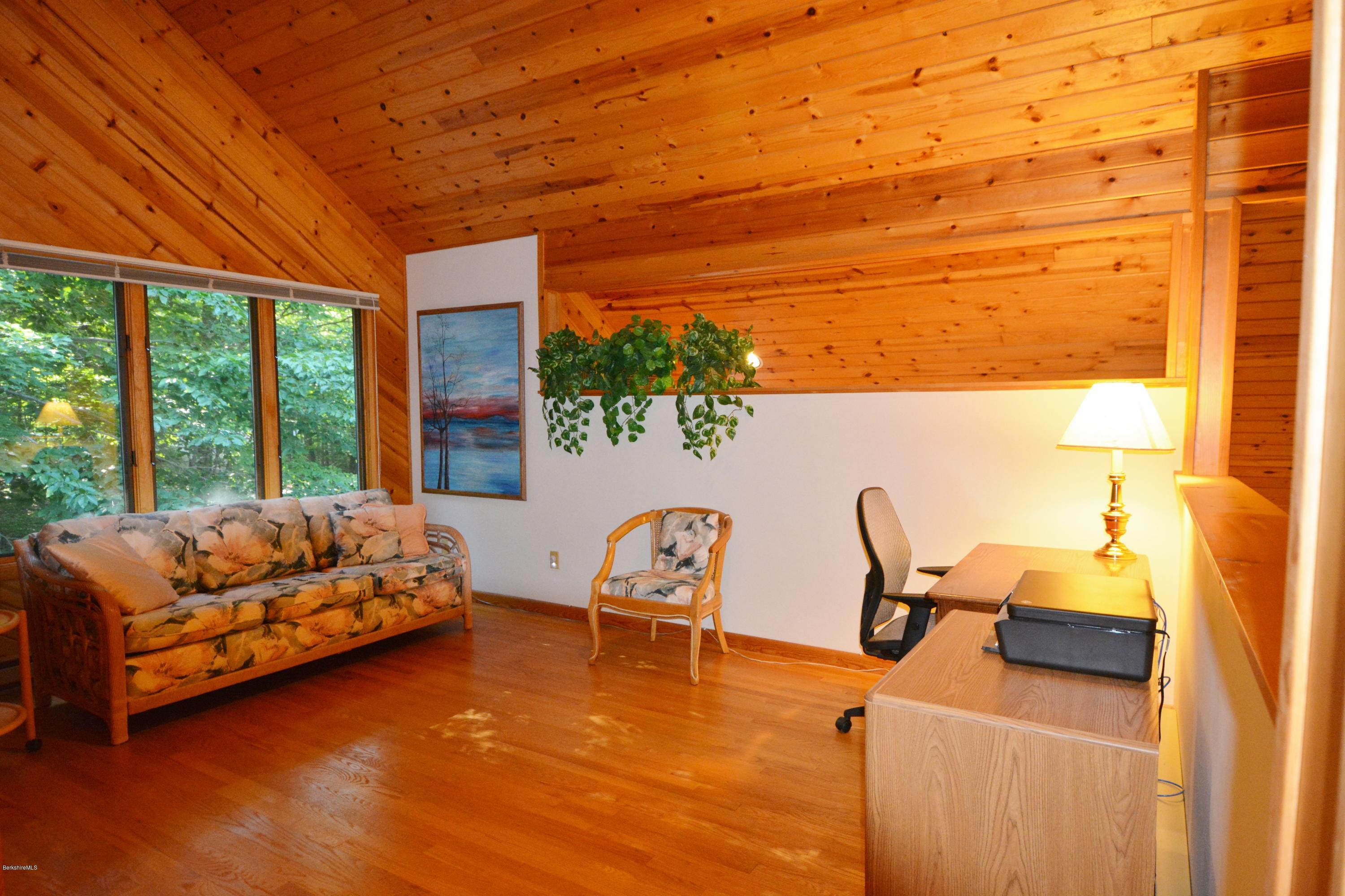 531 Moberg Road Becket, MA 01223 - Photo 15 of 25 a bedroom with furniture and a window