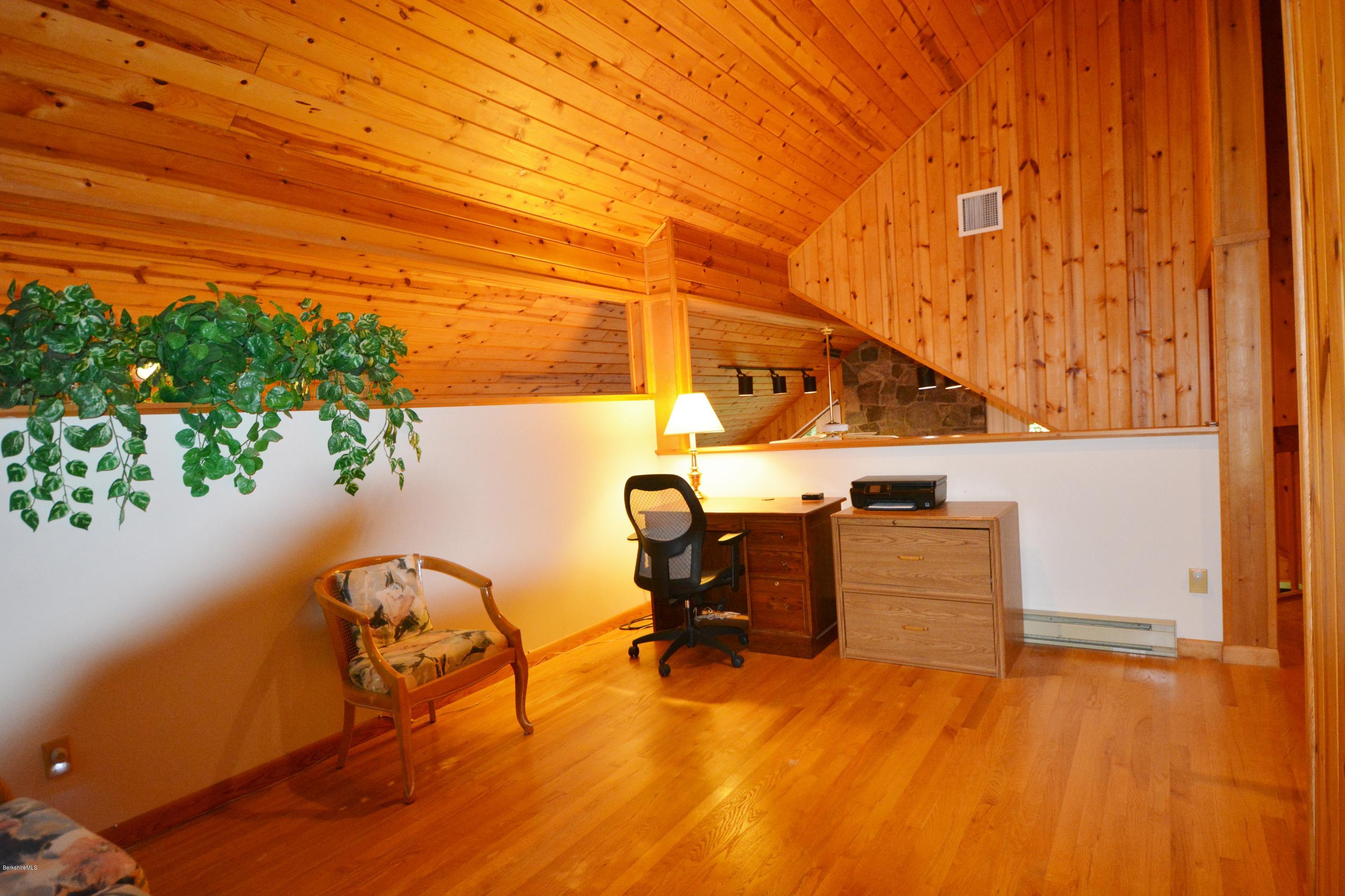 531 Moberg Road Becket, MA 01223 - Photo 16 of 25 a view of workspace with wooden floor