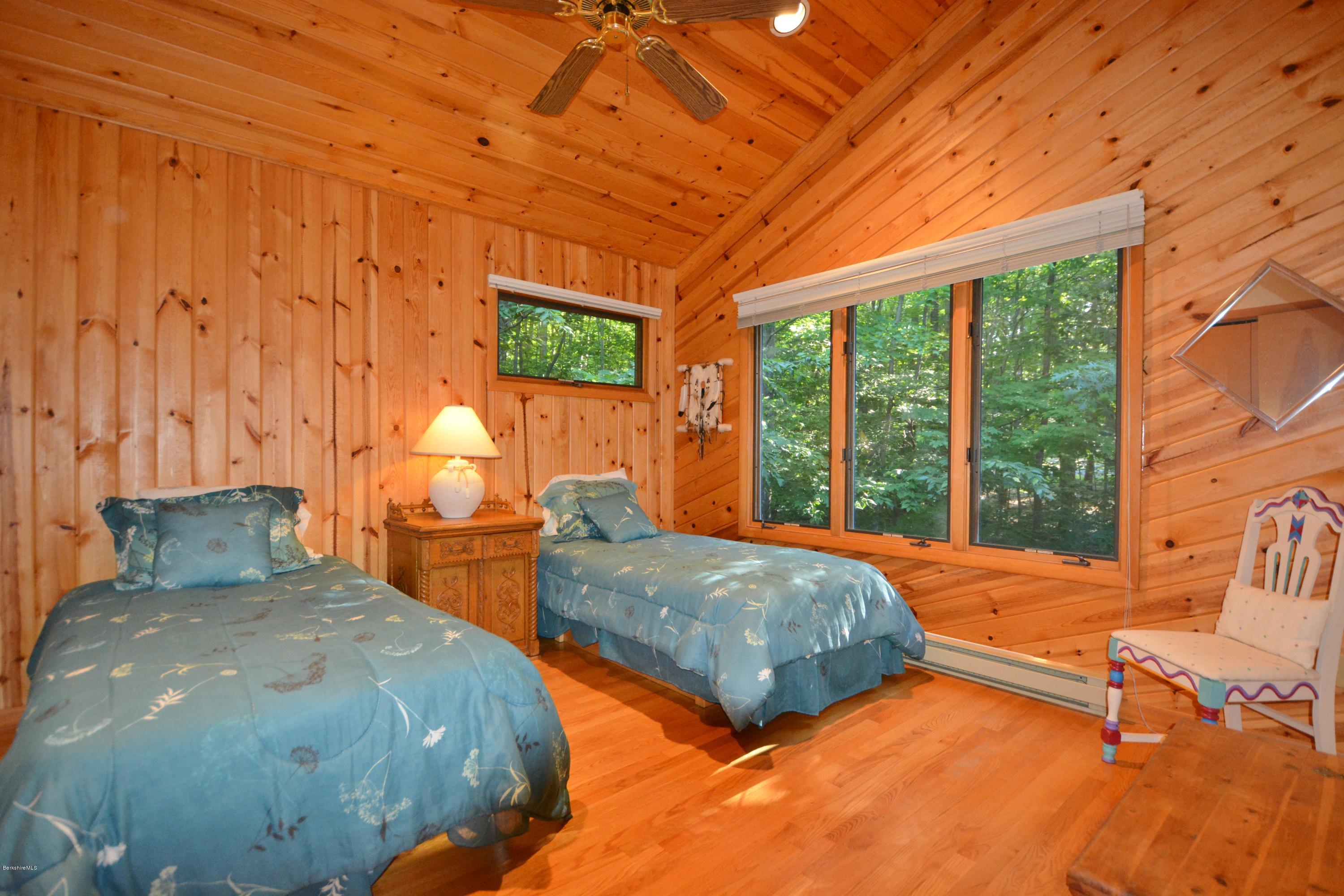 531 Moberg Road Becket, MA 01223 - Photo 18 of 25 a bedroom with two beds and next to a window