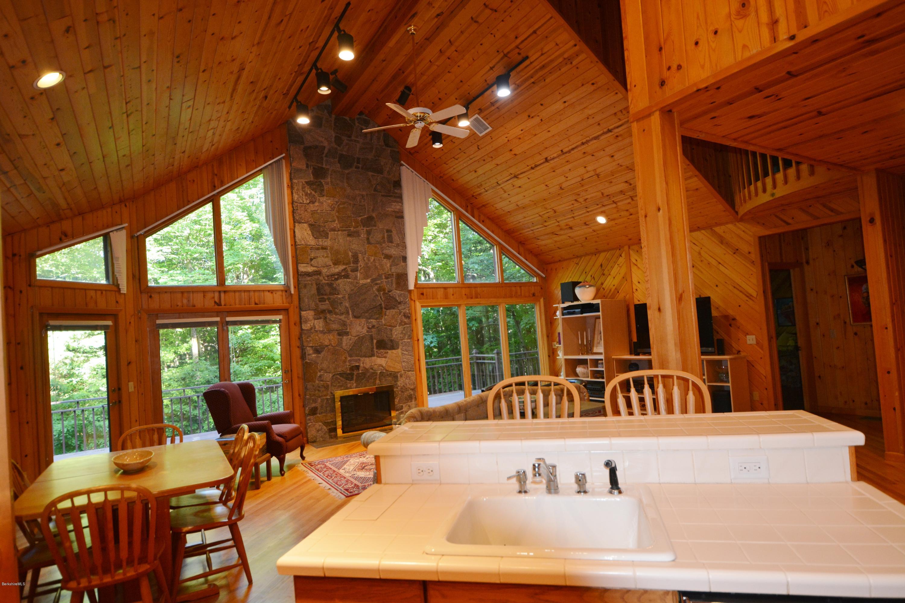 531 Moberg Road Becket, MA 01223 - Photo 6 of 25 a view of a patio with a table and chairs