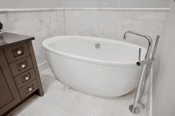 a white bath tub sitting in a bathroom