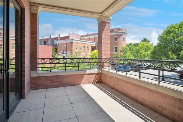 a view of a balcony with potted plants