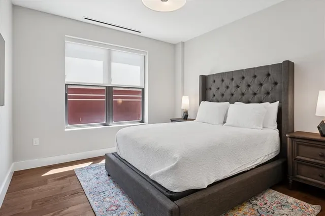 a bedroom with a bed and window