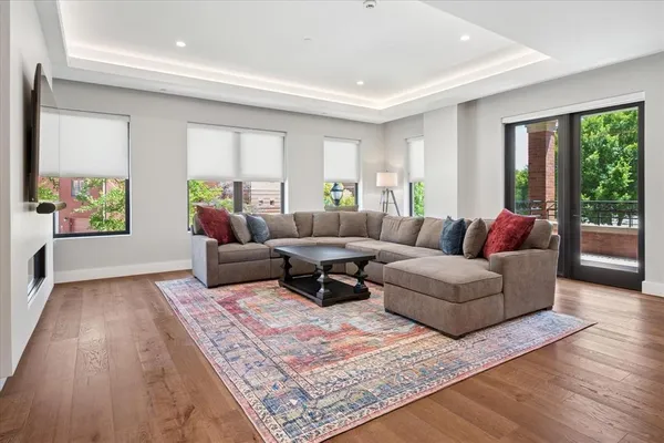 a living room with furniture and a rug