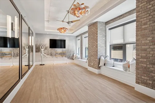 a view of an entryway with wooden floor