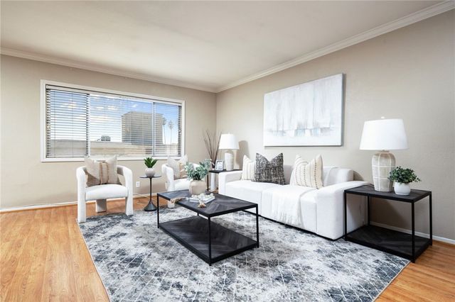 a living room with furniture and a lamp