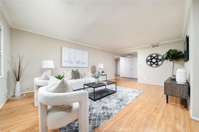a view of a dining room with furniture and window