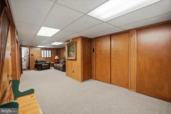 a view of a livingroom with furniture and a window