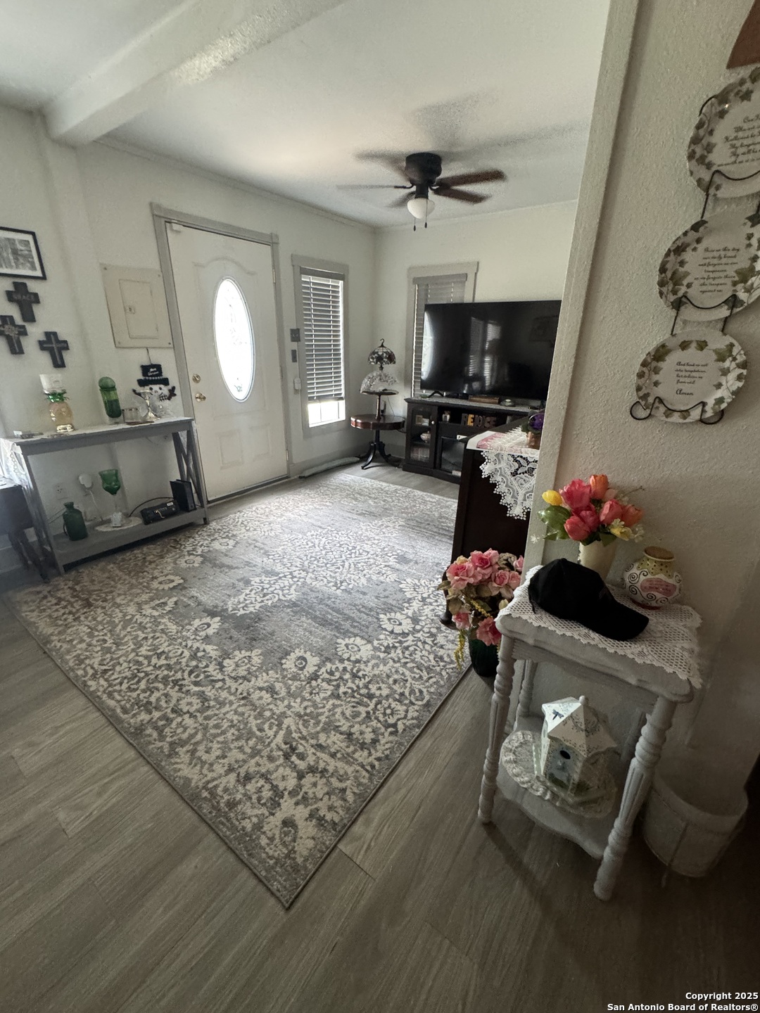 a living room with furniture and a flat screen tv