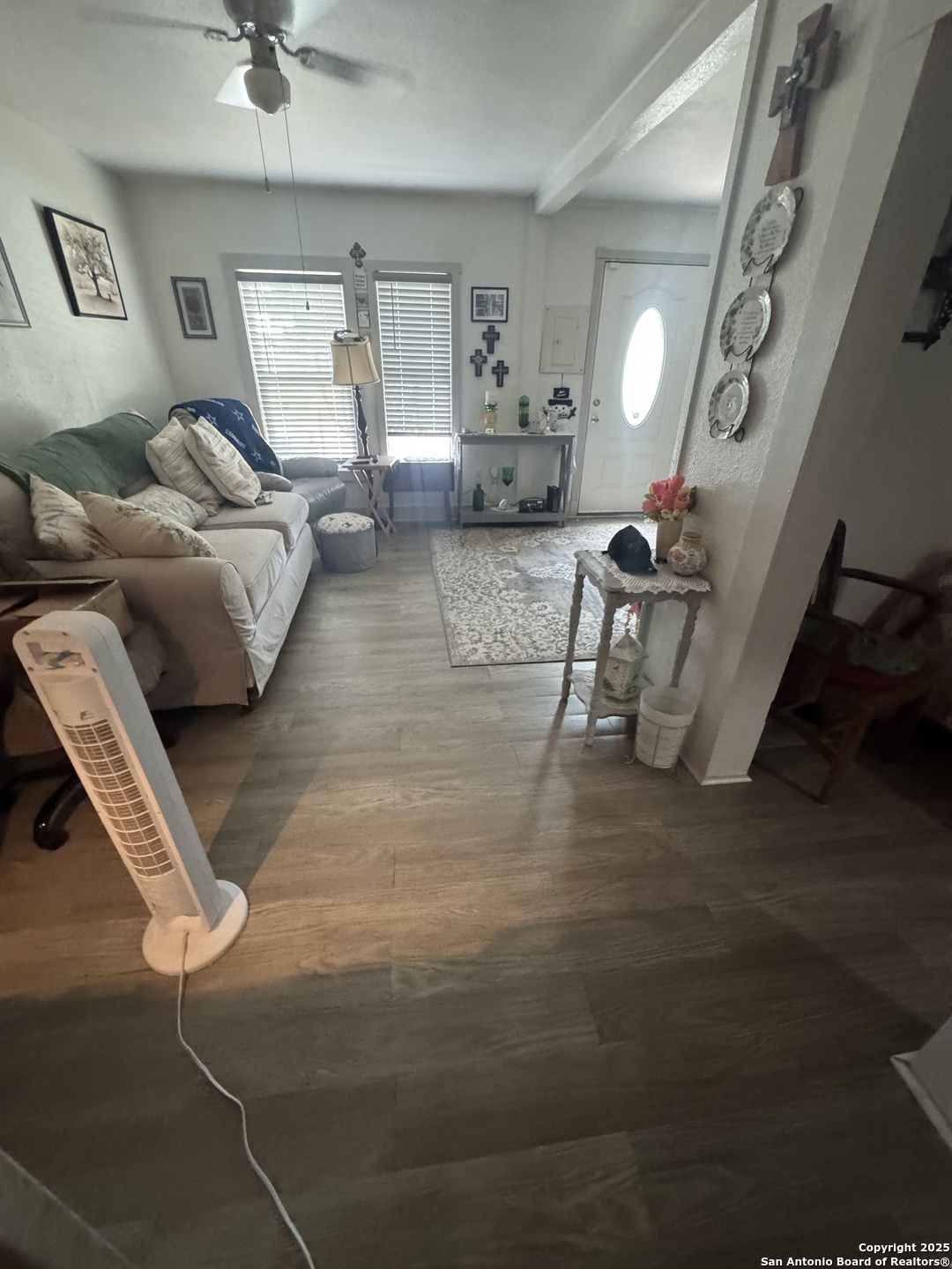223 West Rio Grande Street Pearsall, TX 78061 - Photo 11 of 14 a living room with furniture and a wooden floor