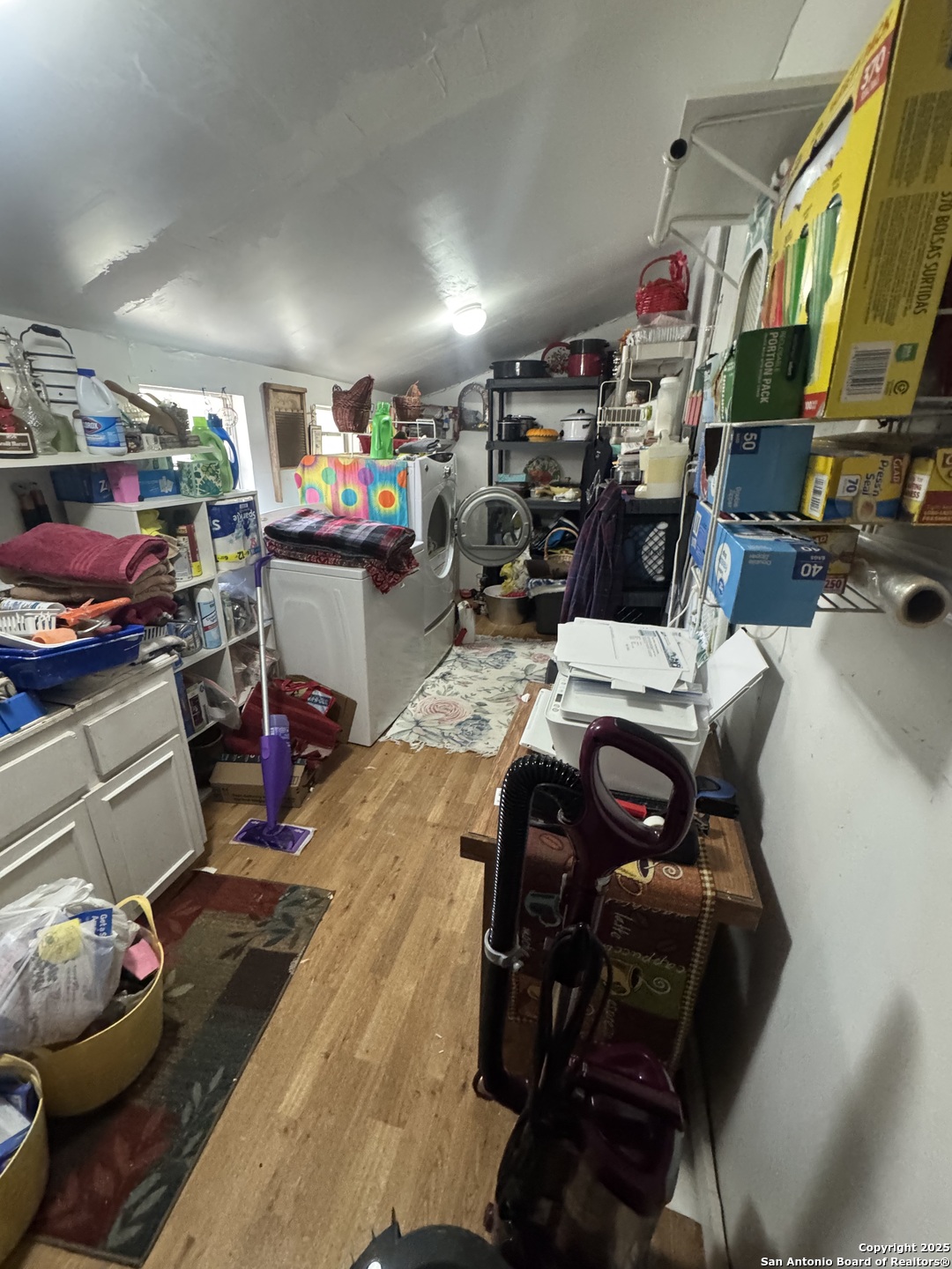 223 West Rio Grande Street Pearsall, TX 78061 - Photo 14 of 14 a storage room with furniture and a flat screen tv