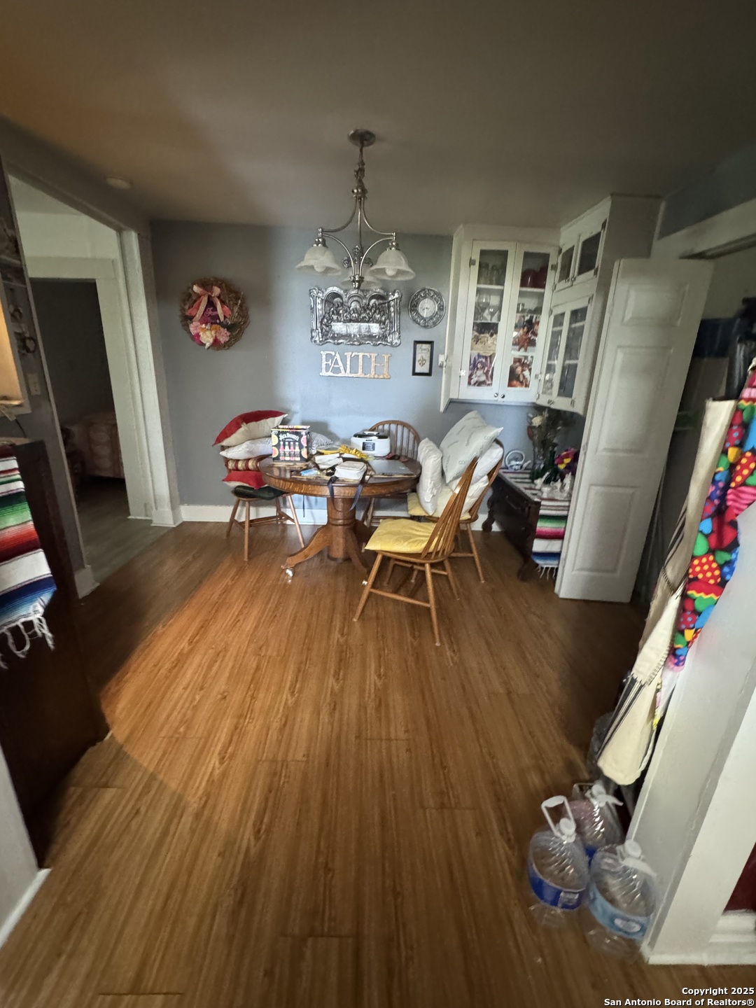 223 West Rio Grande Street Pearsall, TX 78061 - Photo 2 of 14 a living room with furniture and a flat screen tv