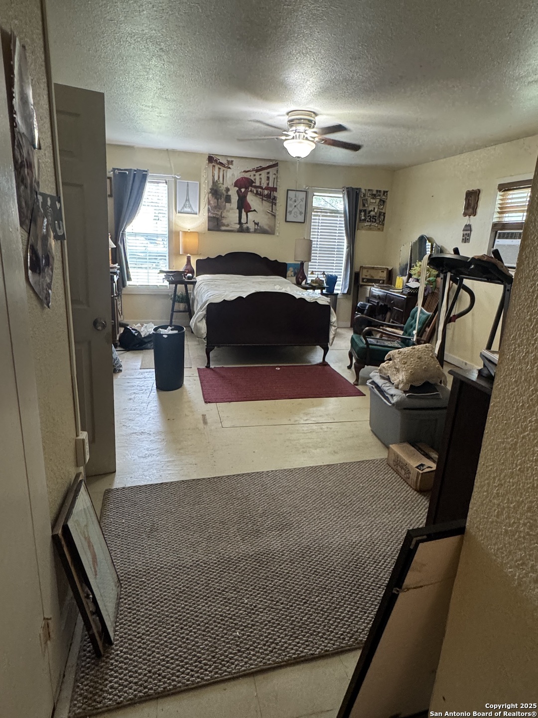223 West Rio Grande Street Pearsall, TX 78061 - Photo 3 of 14 a living room with furniture a chandelier and a flat screen tv