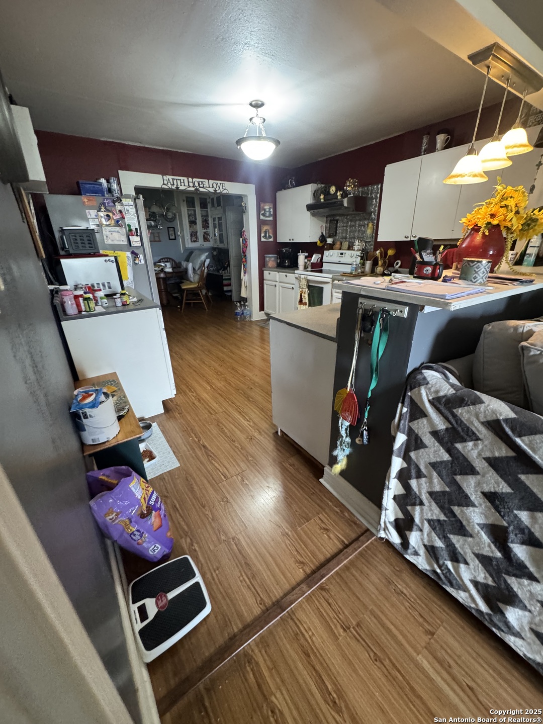 223 West Rio Grande Street Pearsall, TX 78061 - Photo 5 of 14 a room with furniture and a flat screen tv