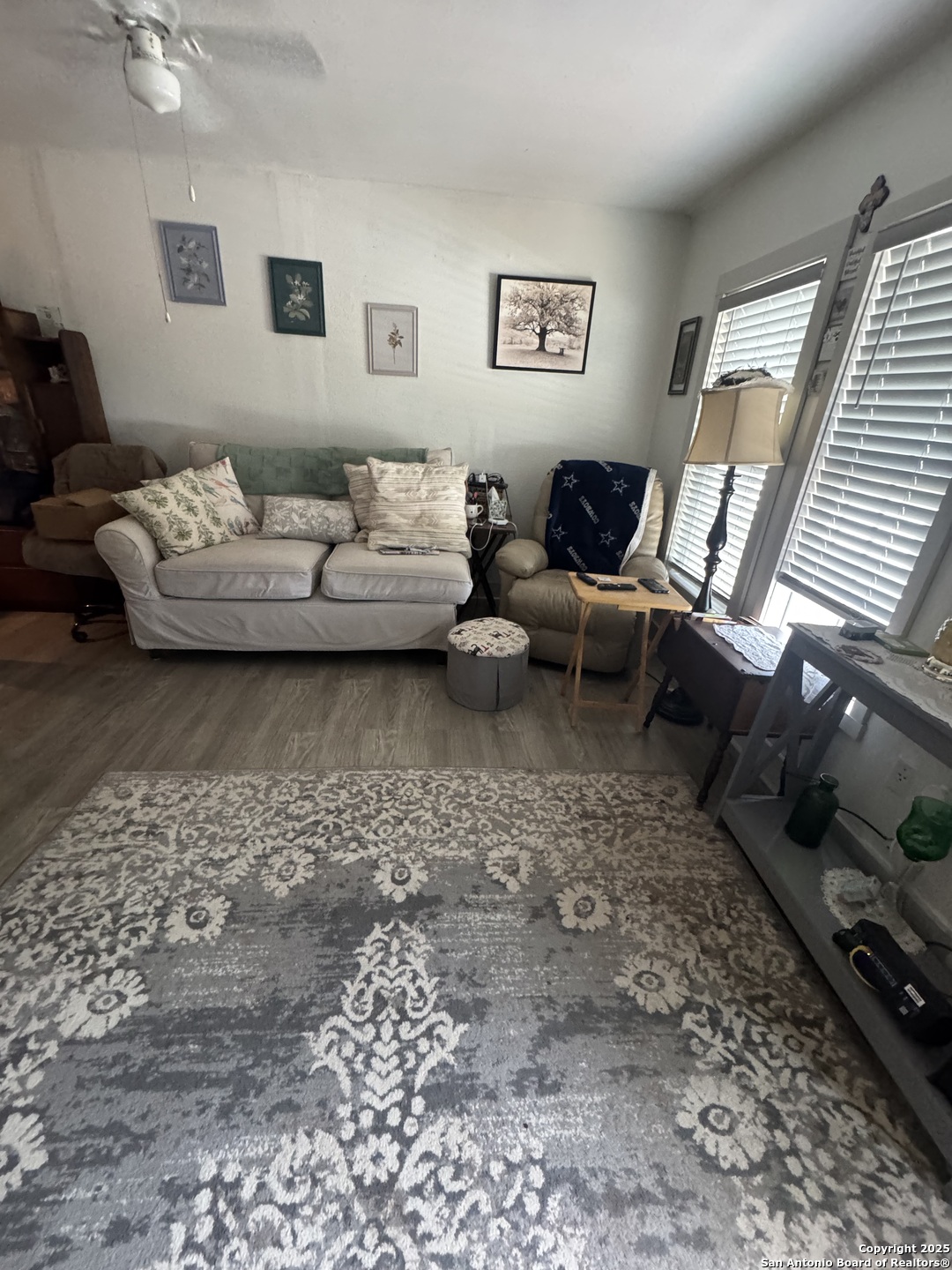 223 West Rio Grande Street Pearsall, TX 78061 - Photo 9 of 14 a living room with furniture and a couch
