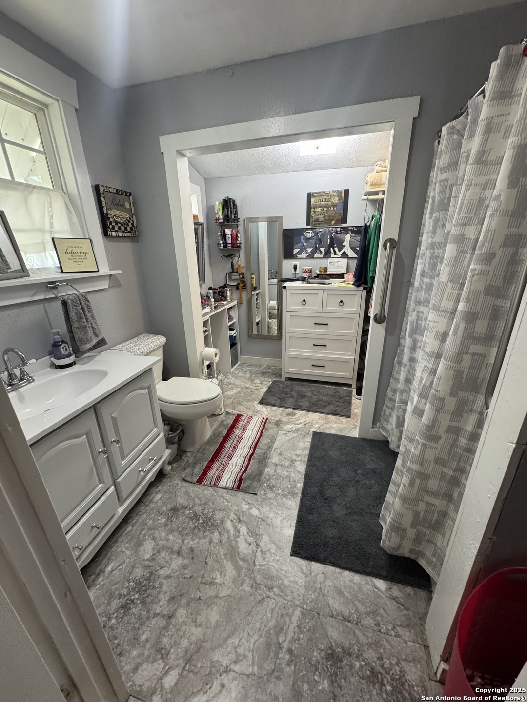 223 West Rio Grande Street Pearsall, TX 78061 - Photo 10 of 14 a living room with a couch and a table