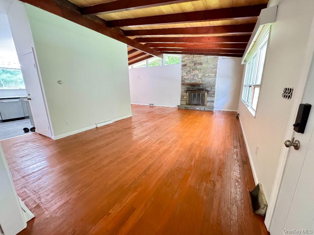 170 Leber Road Blauvelt, NY 10913 - Photo 7 of 15 an empty room with wooden floor and windows