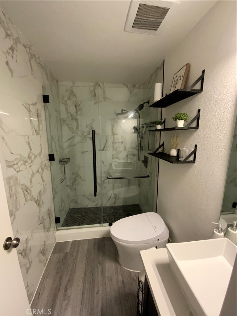4140 Workman Mill Road, Unit 172 Whittier, CA 90601 - Photo 19 of 21 a bathroom with a sink a toilet and shower