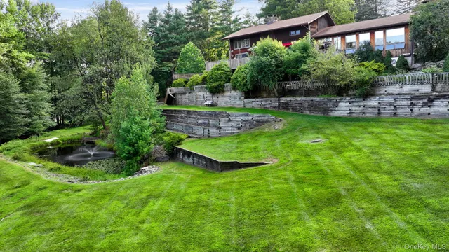 a view of a backyard with plants and a patio