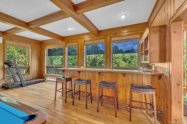 a view of a dining room with furniture window and outside view
