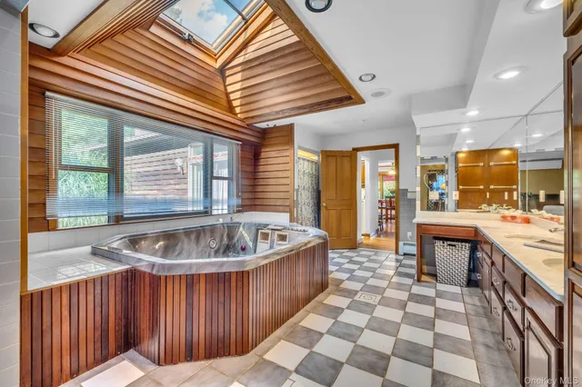 a kitchen with a stove a sink and a microwave