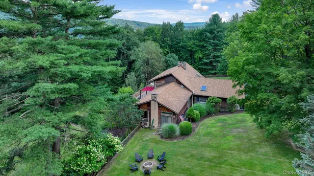 a view of a house with a yard and garden
