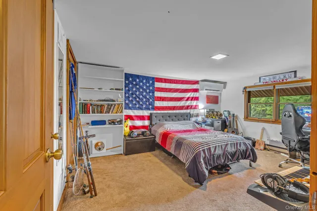 a bedroom with a bed and a window