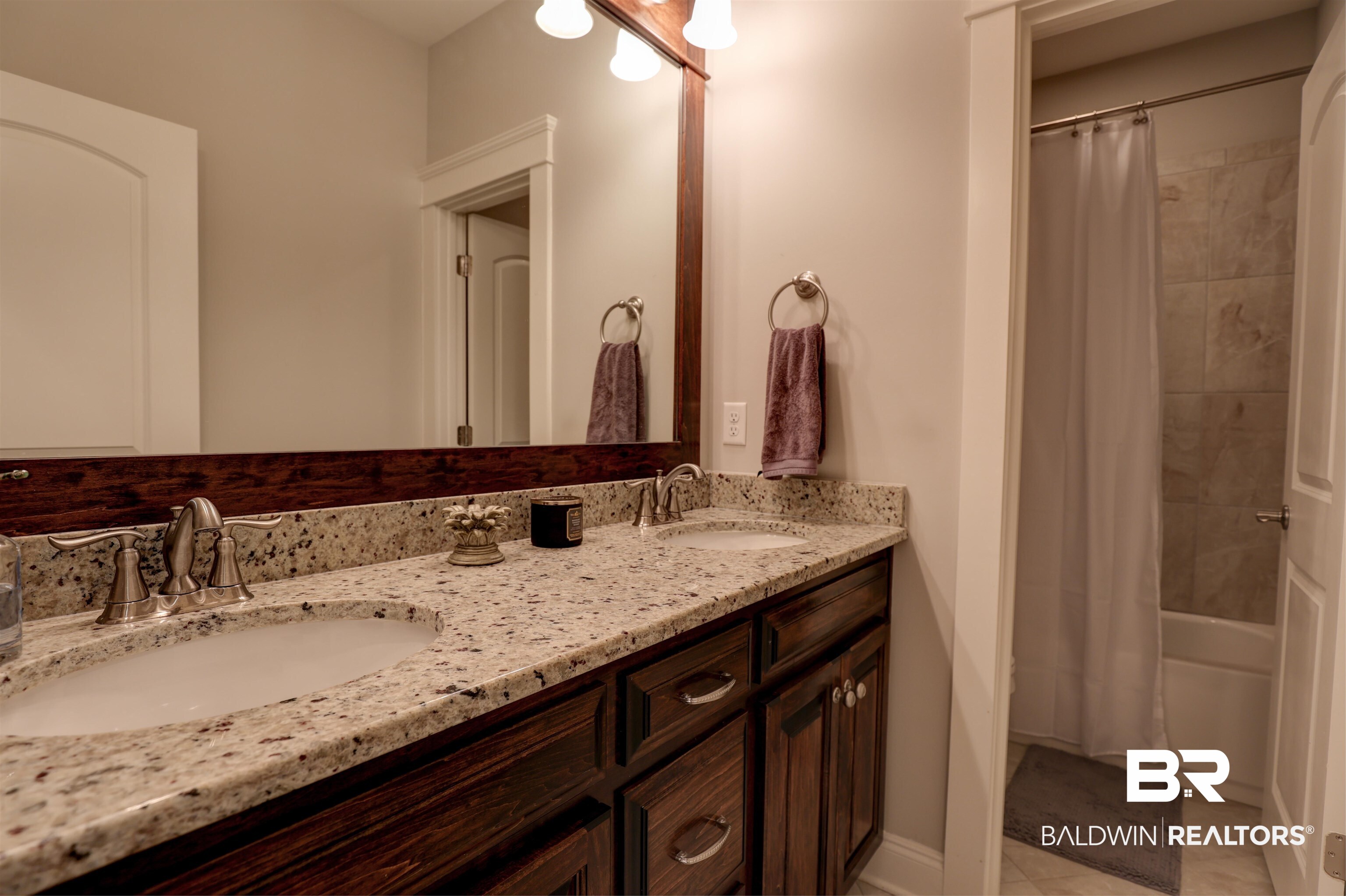 10588 Leesburg Pike Daphne, AL 36526 - Photo 19 of 29 Bathroom featuring double vanity, shower / bath combo, and tile patterned floors