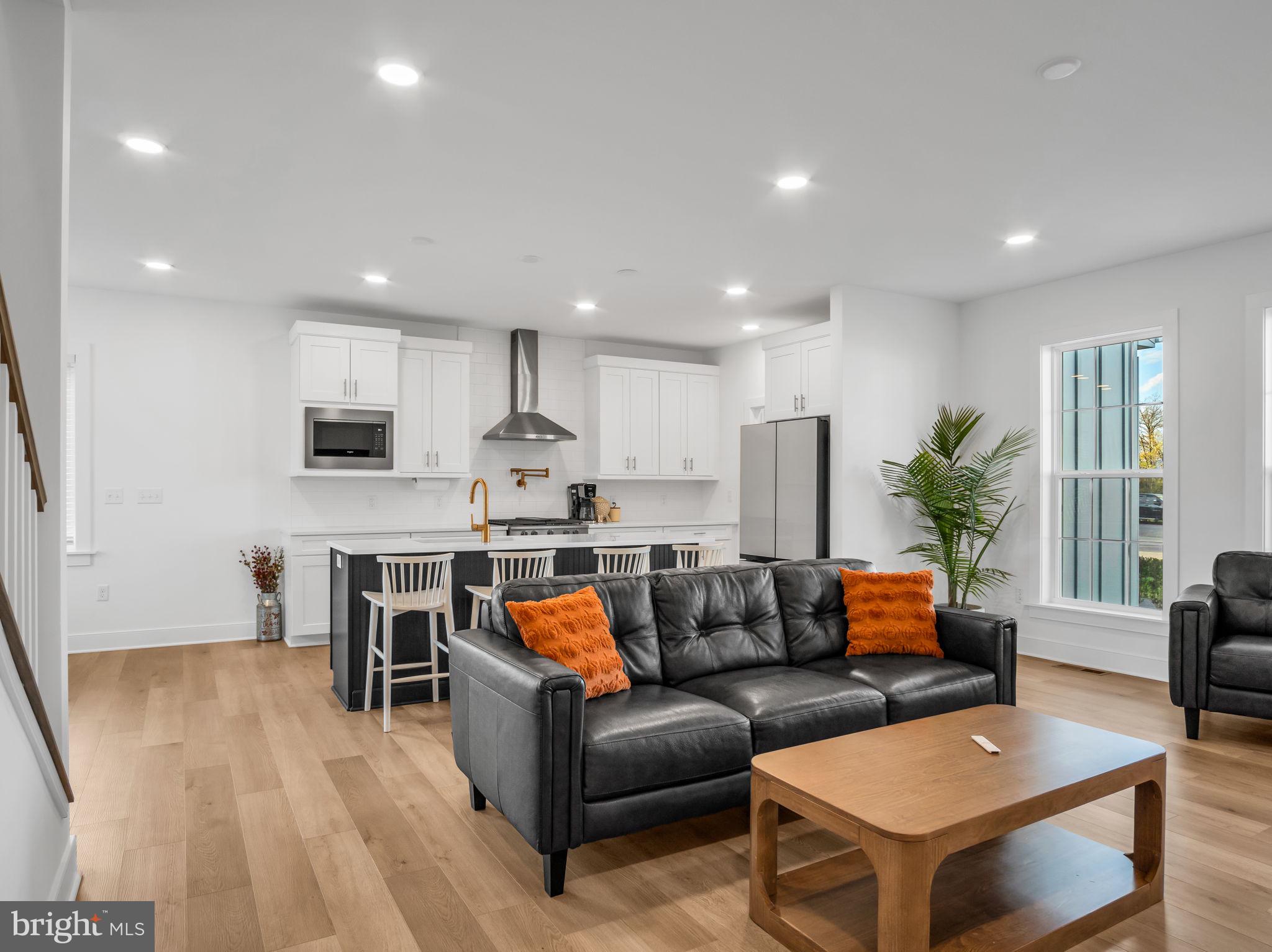2 Wagon Way Carlisle, PA 17015 - Photo 15 of 64 a living room with furniture and a dining table with kitchen view